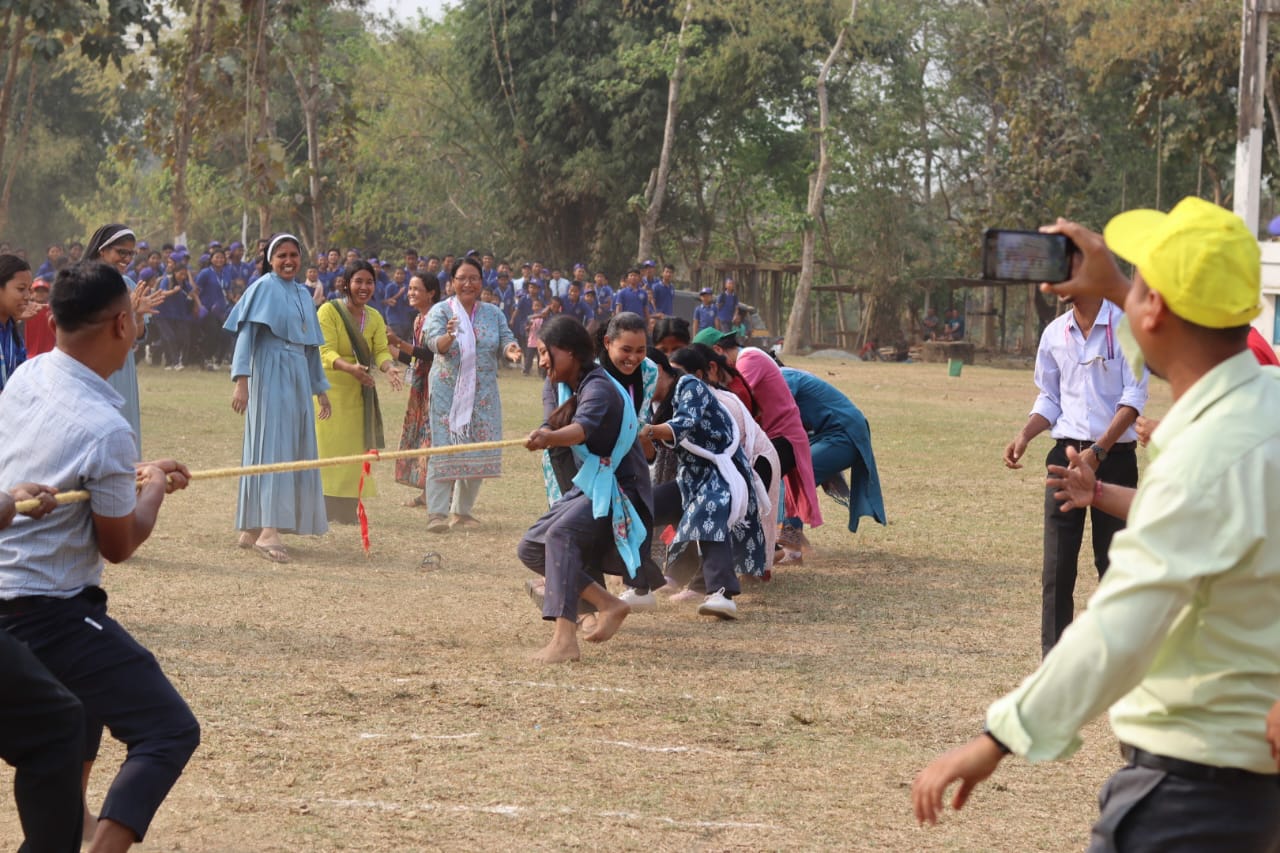 Teachers competing in a tug of war