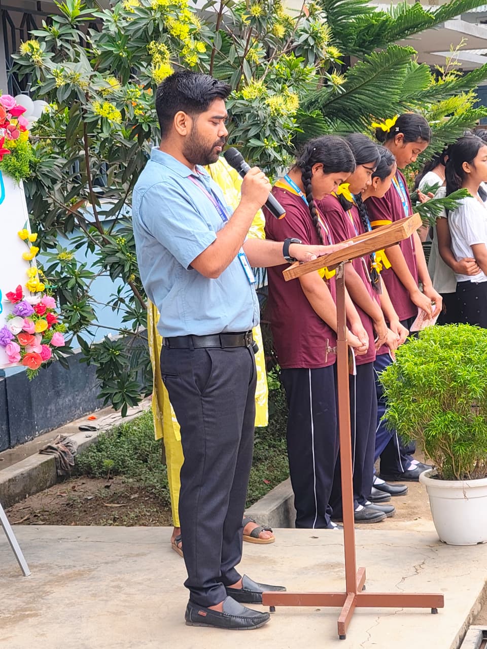 A teacher addressing students at Don Bosco Tikrikilla