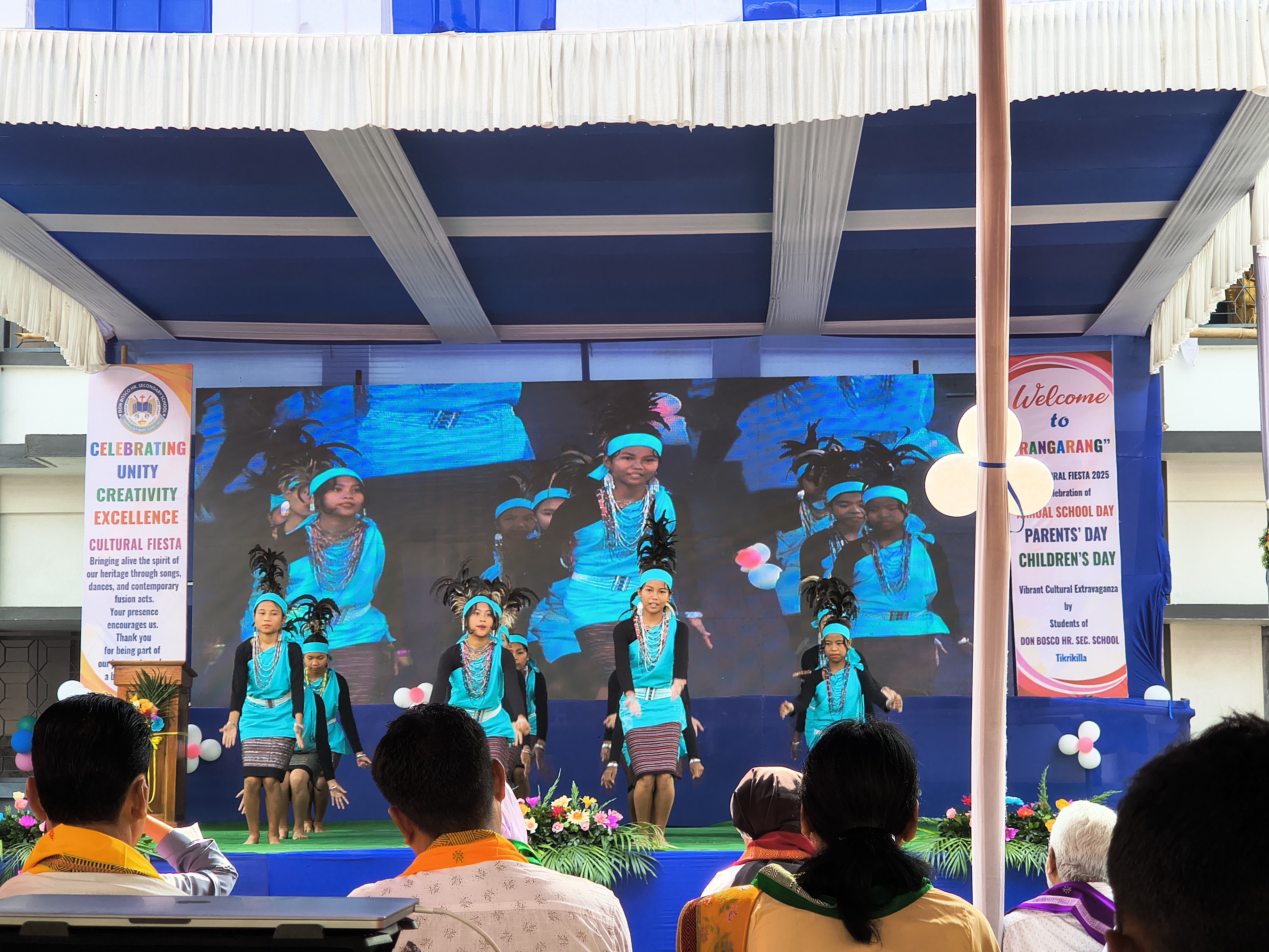 Students performing tribal dance in cultural dress