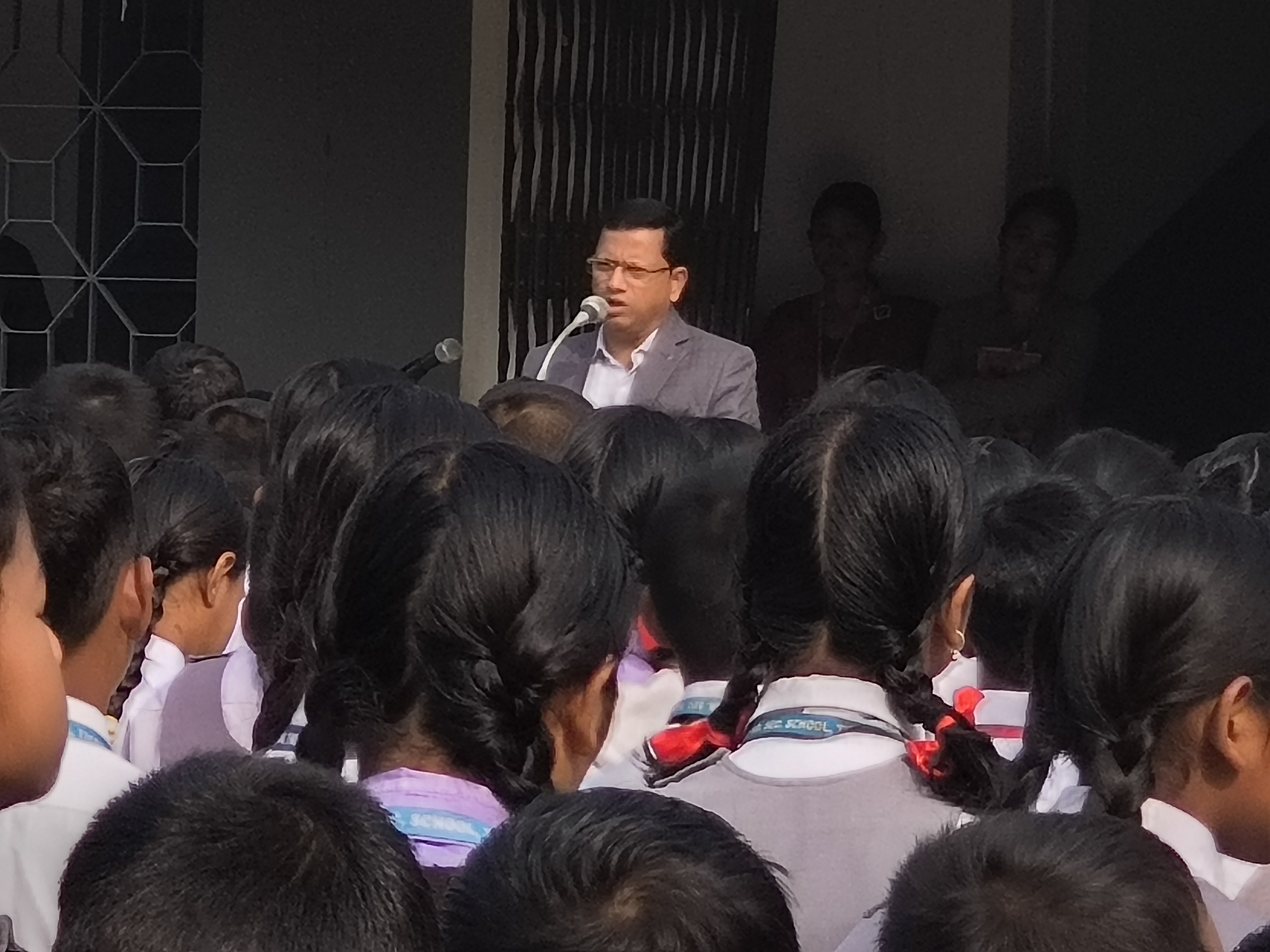 Principal addressing students